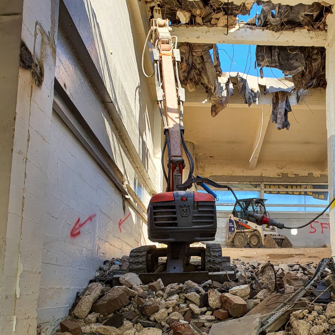 Top-down robotic demolition of a multi-storey structure