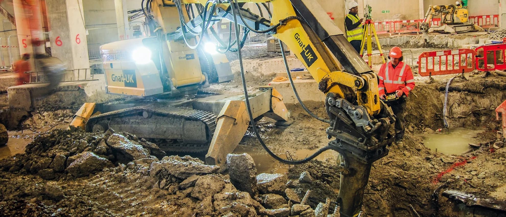 Brokk remote-operated robotic demolition machine working inside a confined-access industrial space