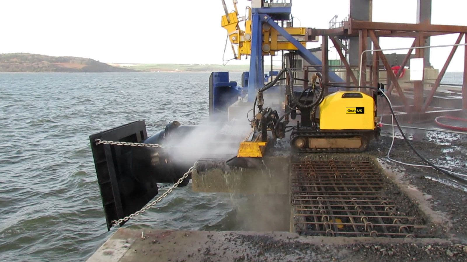 Conjet hydrodemolition robot stripping degraded concrete from a North Sea jetty deck