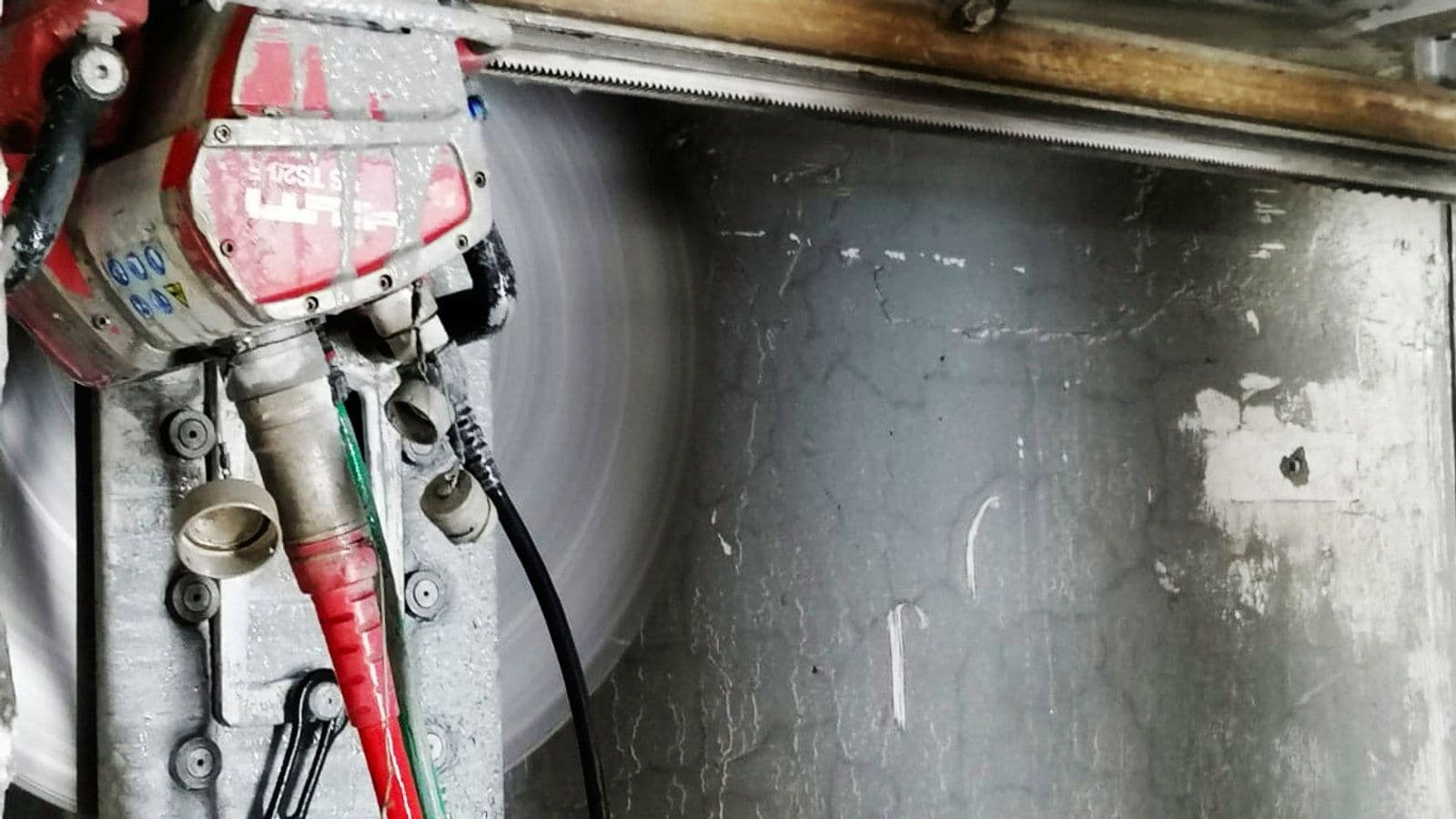 Diamond track saw cutting through a heavily reinforced Bank of England vault wall in a Grade I listed London building
