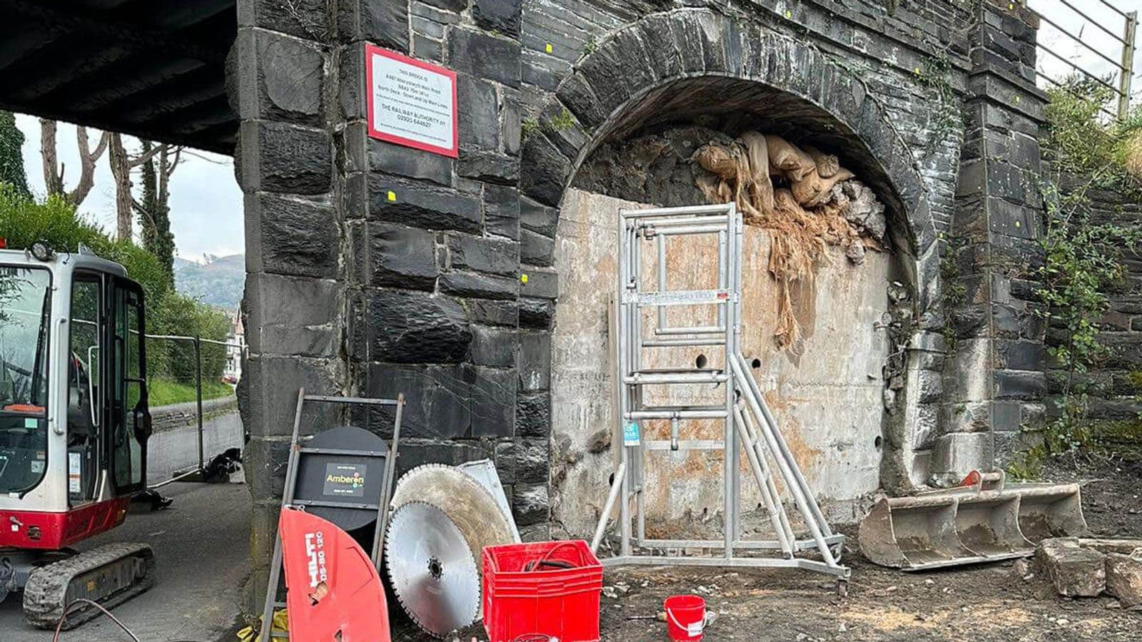 Brokk robot deconstructing concrete infill inside a sealed Beeching-era railway arch