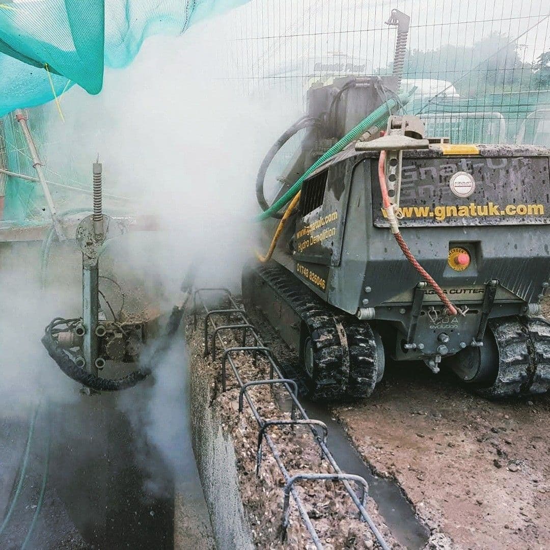 Aquajet hydrodemolition robot deconstructing a motorway bridge parapet