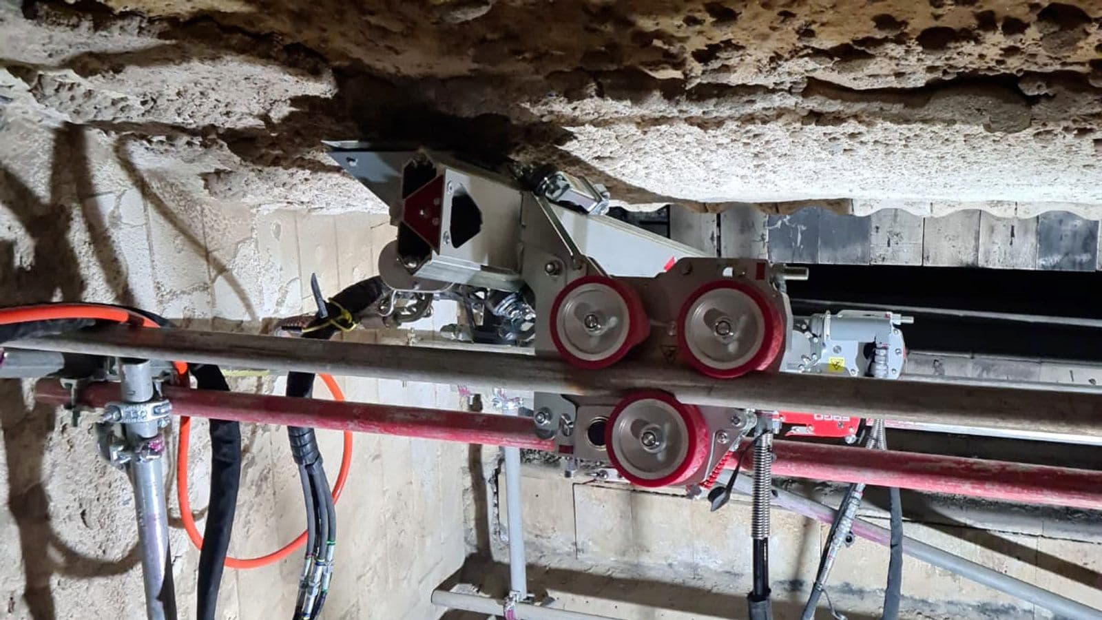 Aquajet ERGO hydrodemolition system removing castable refractory inside a biomass boiler furnace